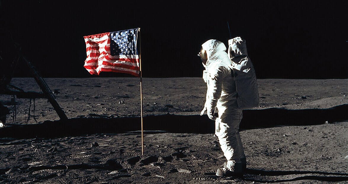 Apollo 11 mission, astronaut plating US flag on moon
